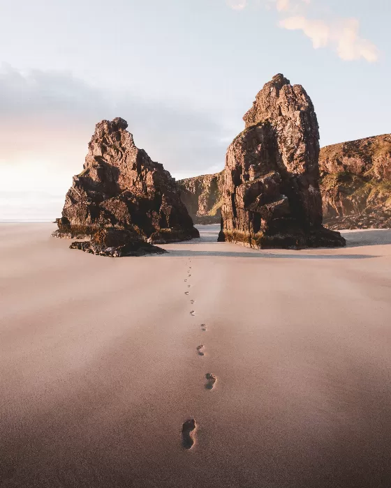 Footsteps on the sand passing through the outer Hebrides island Scotland